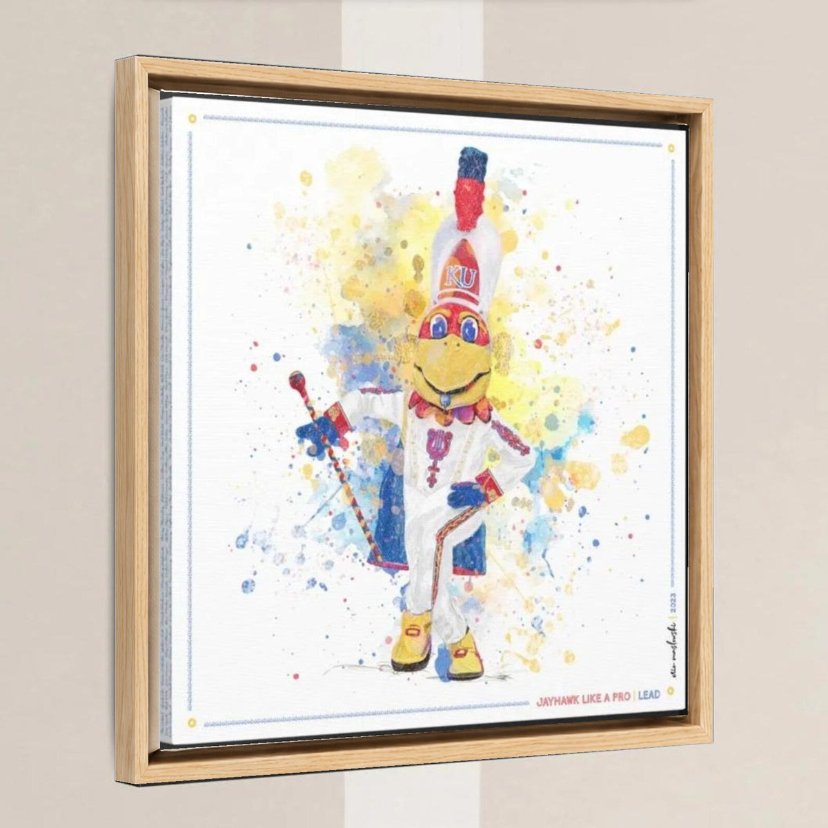 KU Jayhawk Lead Band Art: University of Kansas Canvas Print in a light oak float frame