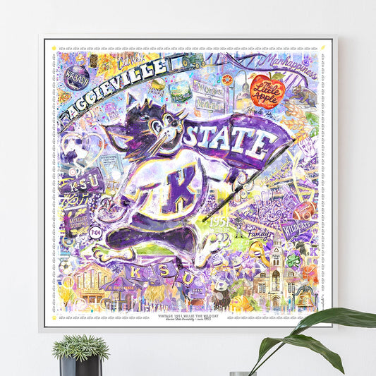 Framed collage with 'STATE' and a cartoon cat on a white wall.