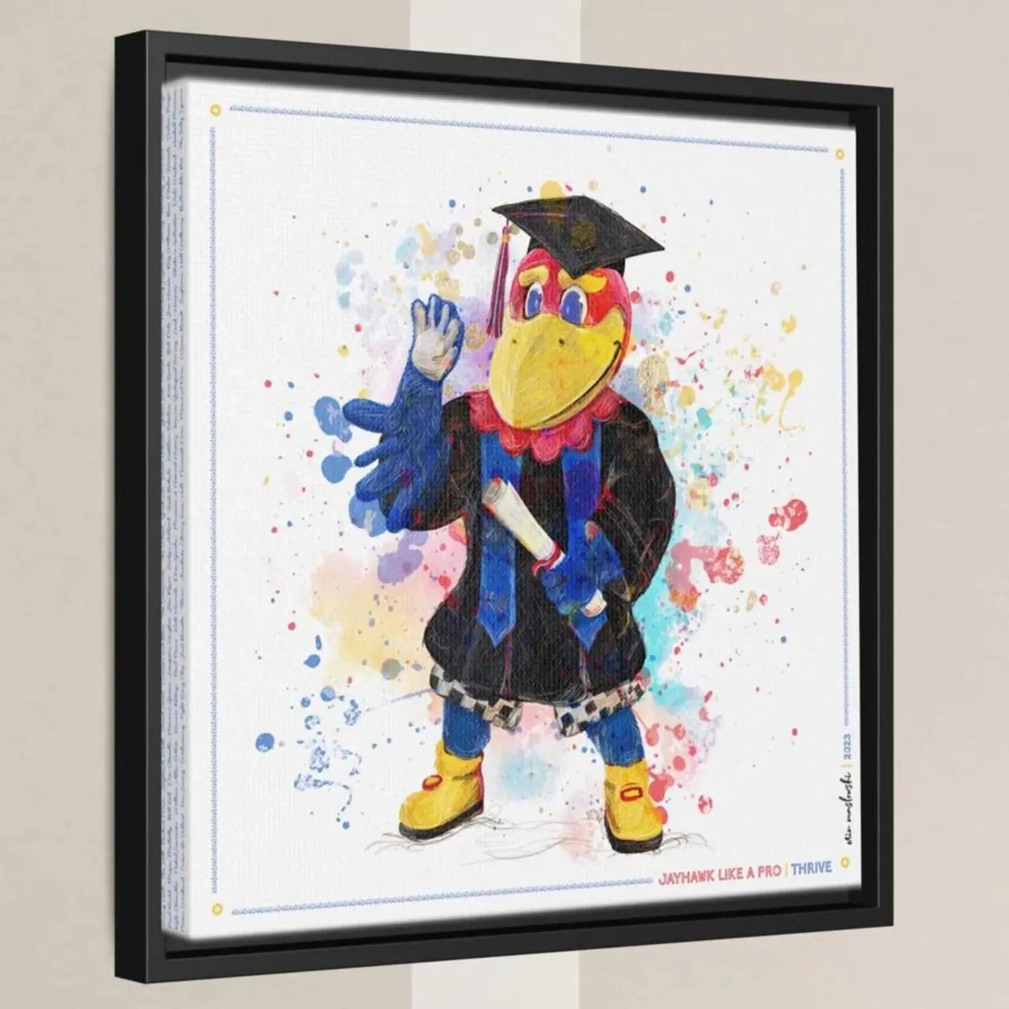 A framed painting depicting a colorful bird character wearing a graduation cap and gown, with a diploma in its hand.