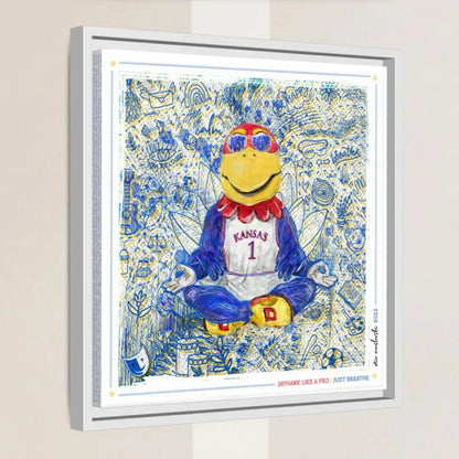 A framed artwork depicting a cartoon character wearing a Kansas University jersey and sunglasses, sitting in a meditative pose with a relaxed expression.