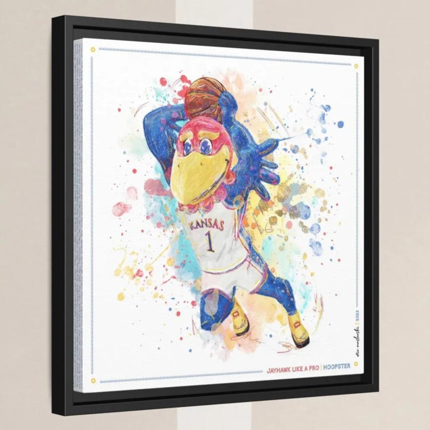 A colorful, abstract painting depicting a bird character wearing a Kansas basketball jersey, with splashes of color surrounding it.