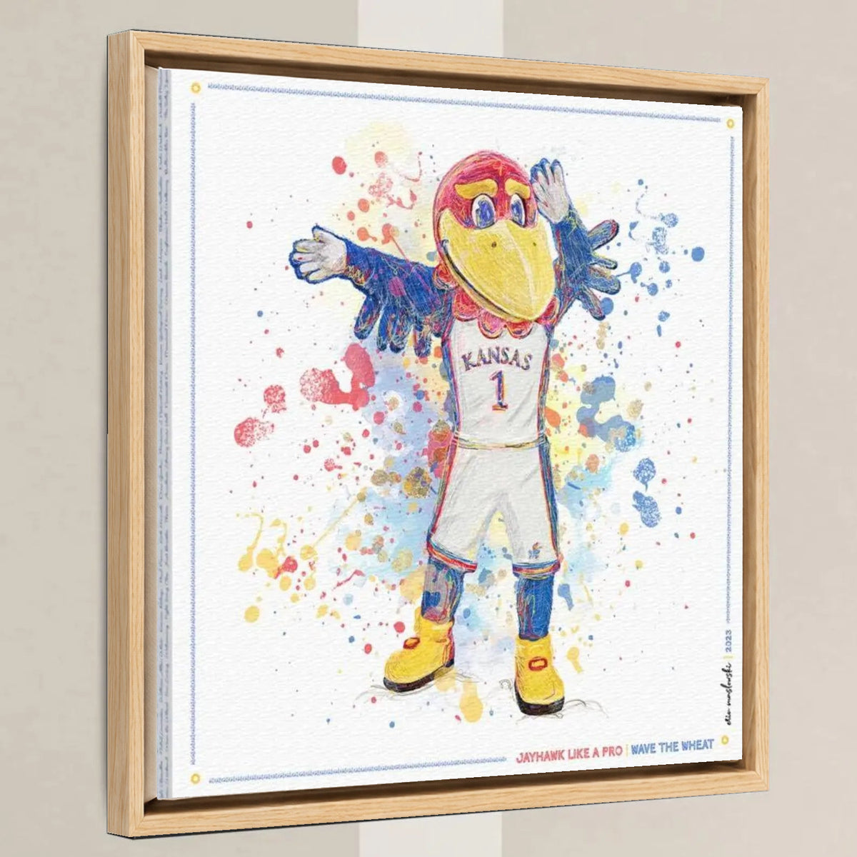KU Jayhawk Wave the Wheat Art: University of Kansas Splatter Paint Canvas Print in a light oak float frame