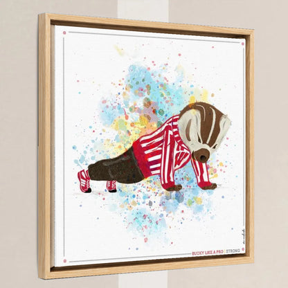 UW Bucky Badger Push-Ups Art: University of Wisconsin Strong Splatter Canvas Print in a light oak float frame