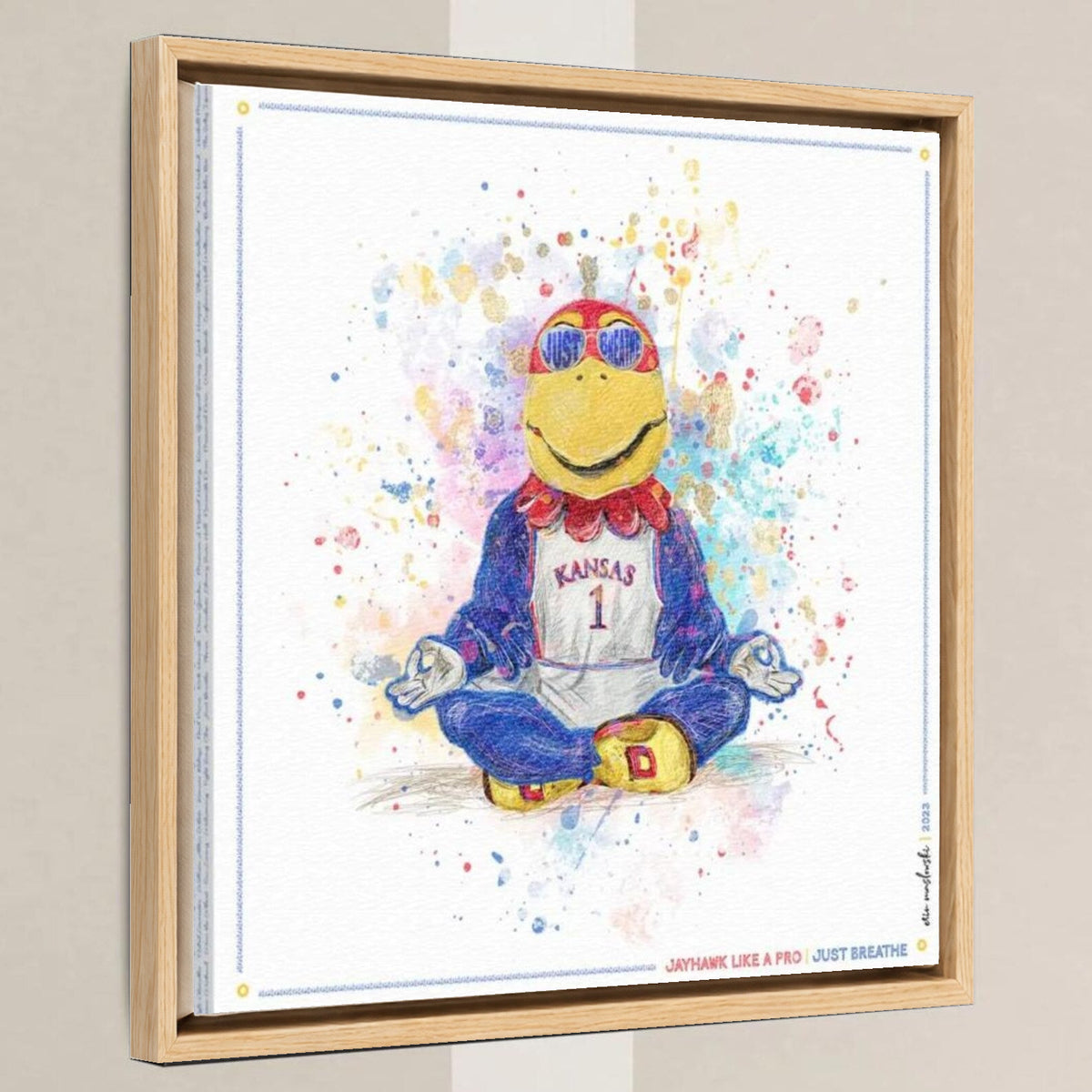 KU Jayhawk Just Breathe Art: University of Kansas Splatter Paint Canvas Print in a light oak float frame