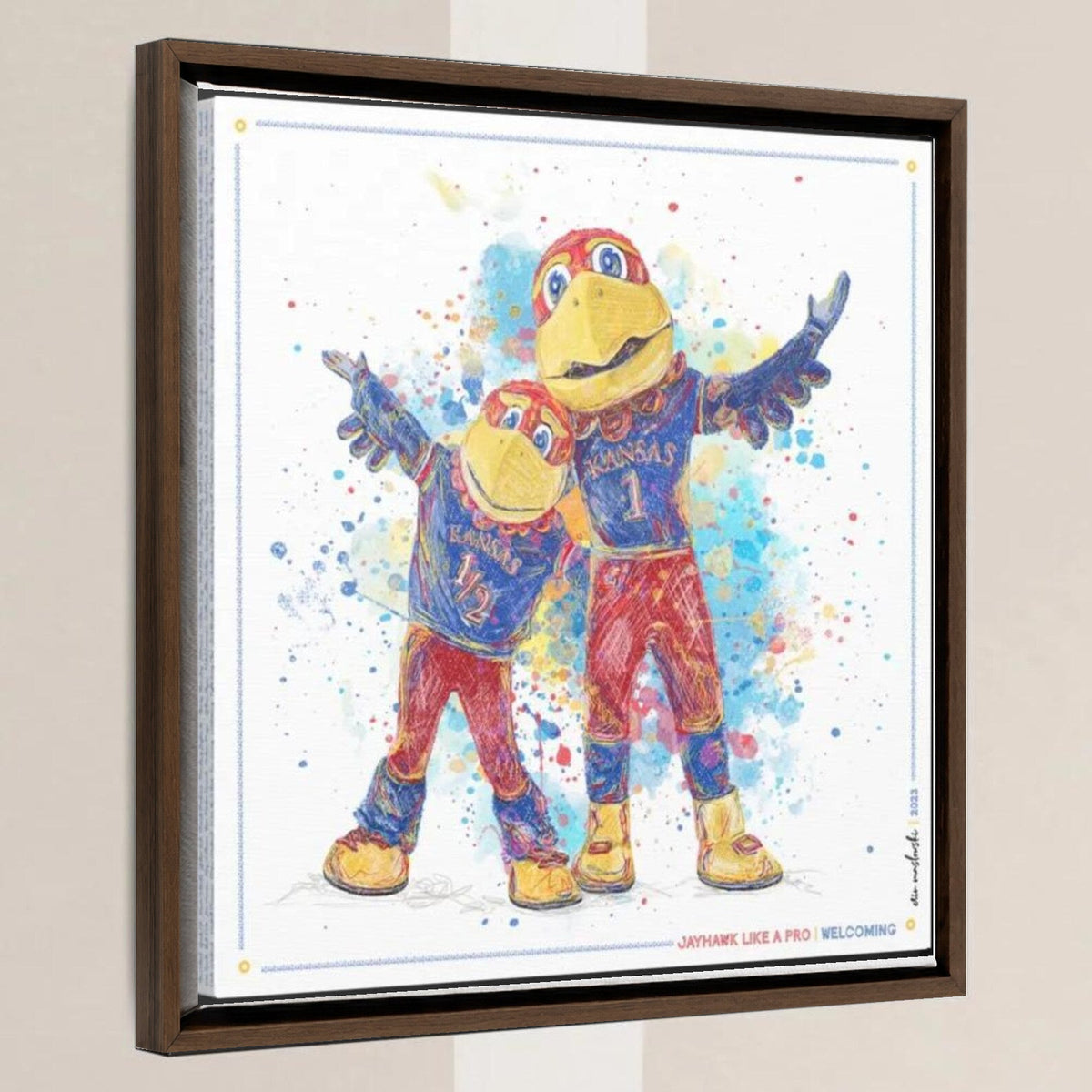 KU Jayhawk Welcoming Art: University of Kansas Big Jay and Baby Jay Splatter Canvas Print in a walnut float frame